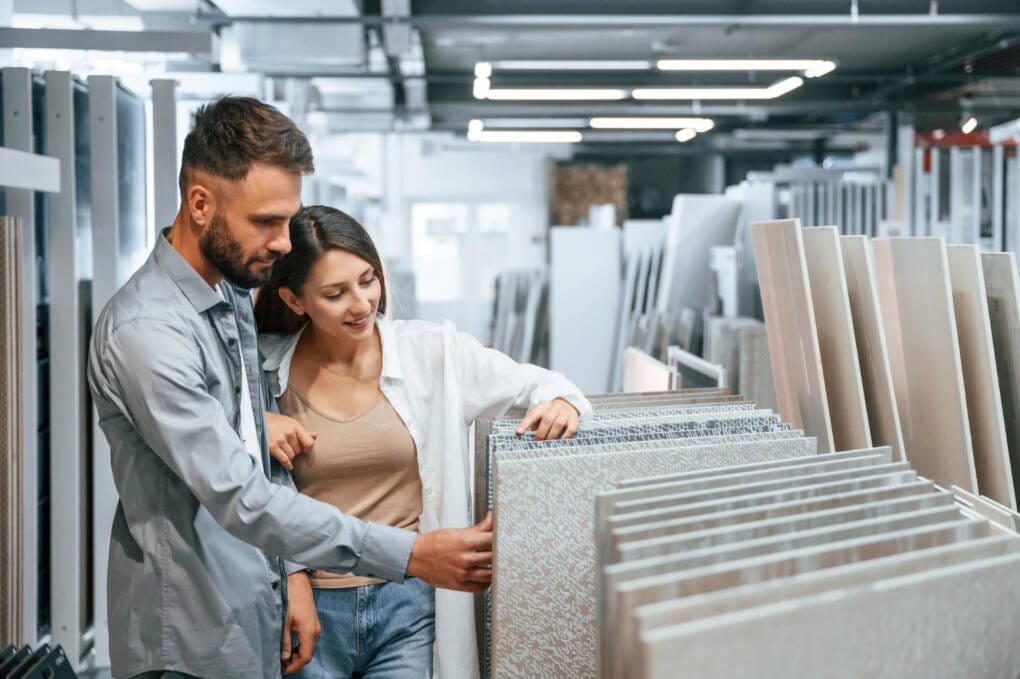 Couple choosing porcelain tiles at a Perth tile showroom