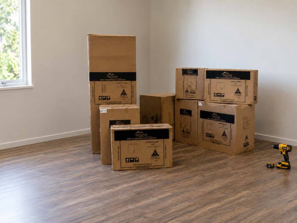 Pre-assembled kitchen cabinets delivered in boxes ready for DIY kitchen cabinet installation in Perth