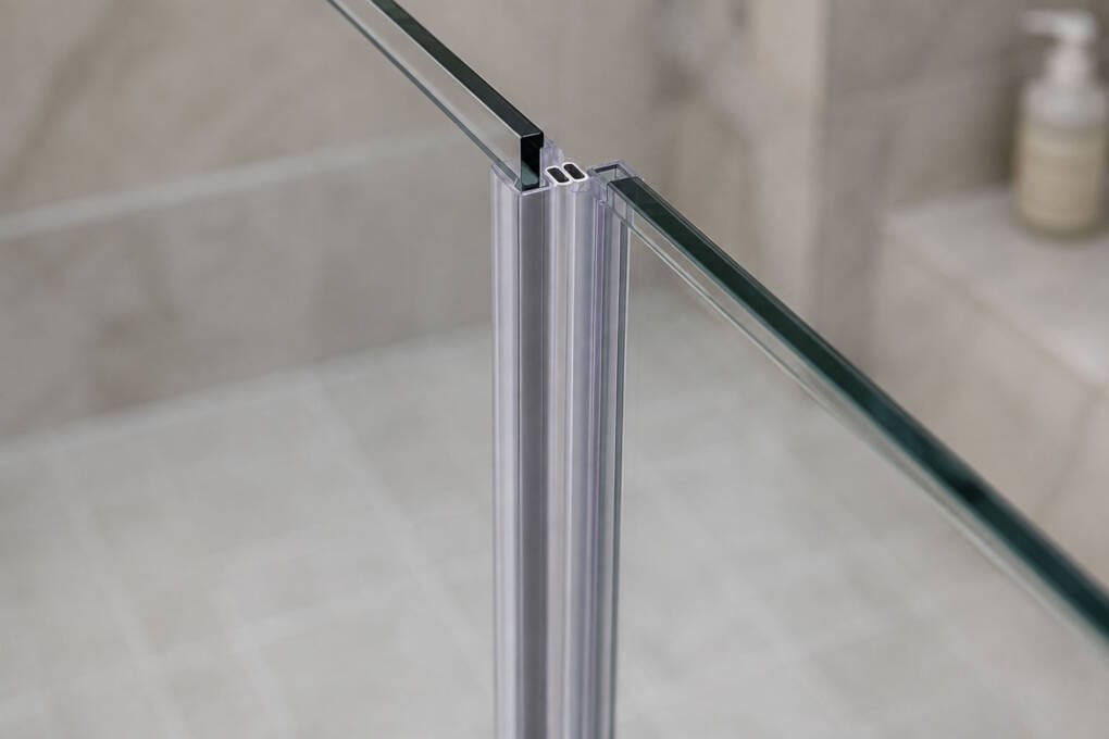 Magnetic and bottom seals controlling water around a closed shower door