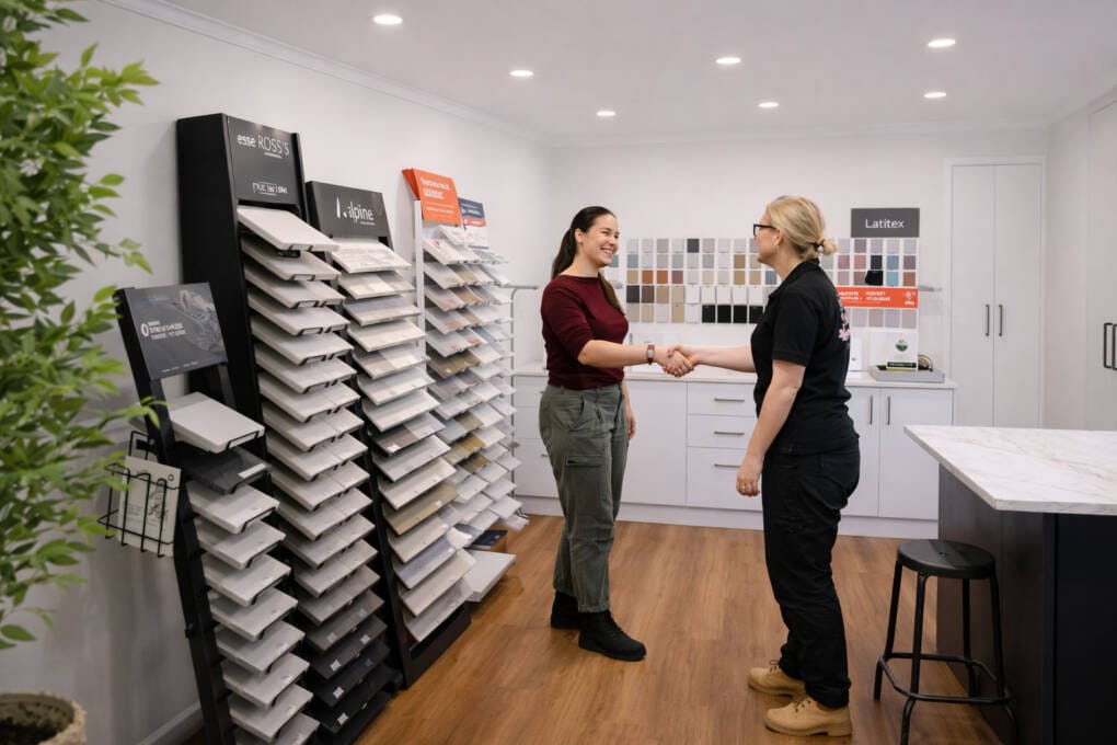 Customer consulting with a Ross's Discount Home Centre staff member in the kitchen showroom