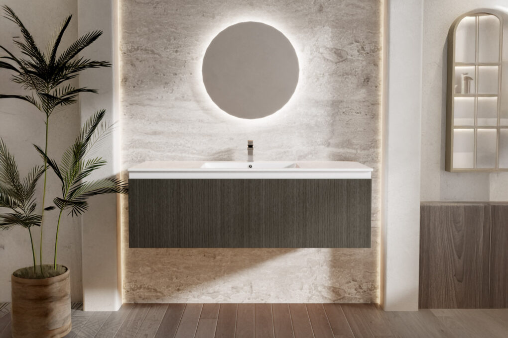 Modern bathroom with a 90cm floating vanity in a woodgrain finish, complemented by a round backlit mirror, textured stone wall, and stylish decor elements.