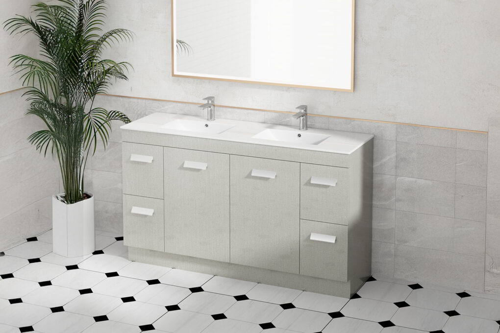 Modern double sink vanity in light gray with textured finish, white rectangular sink basins, chrome faucets, and geometric black and white floor tiles, complemented by a tall palm plant and simple framed mirror
