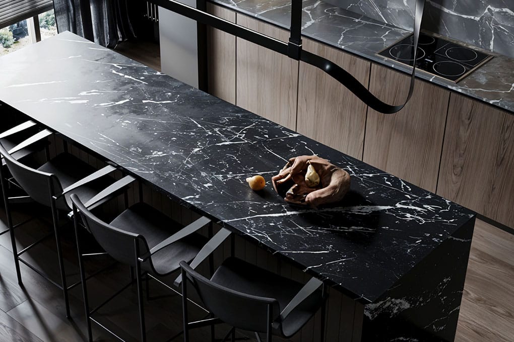 Bold Nero Marquina marble stone kitchen island showcasing dramatic white veining.