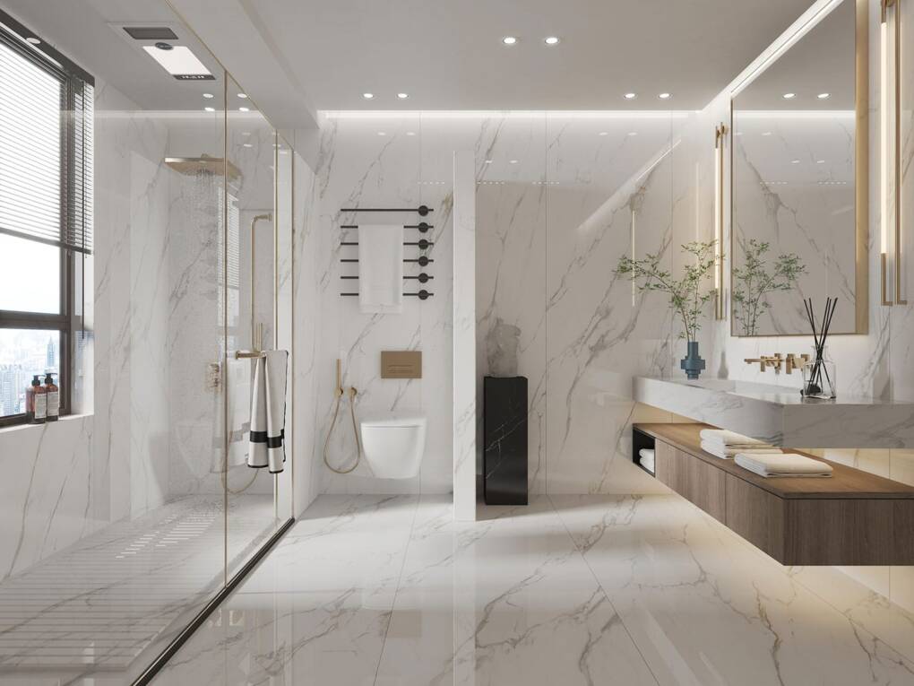 High-gloss white marble tiles in a luxury bathroom with gold fittings