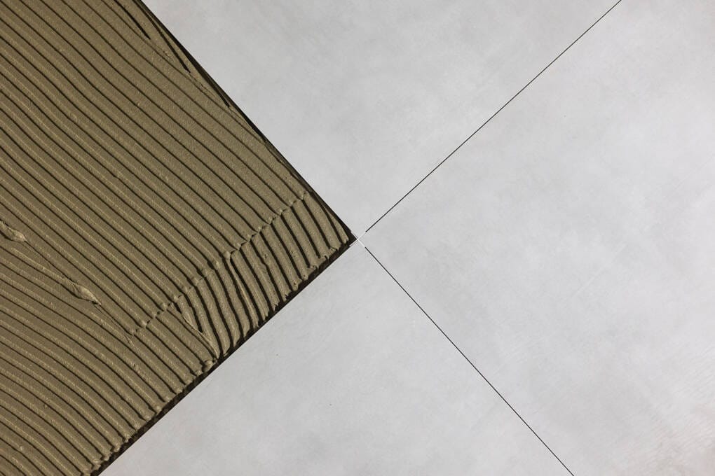 Installing rectified tiles with minimal grout lines for a modern seamless look