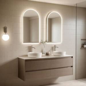 LED arched mirrors above floating vanity