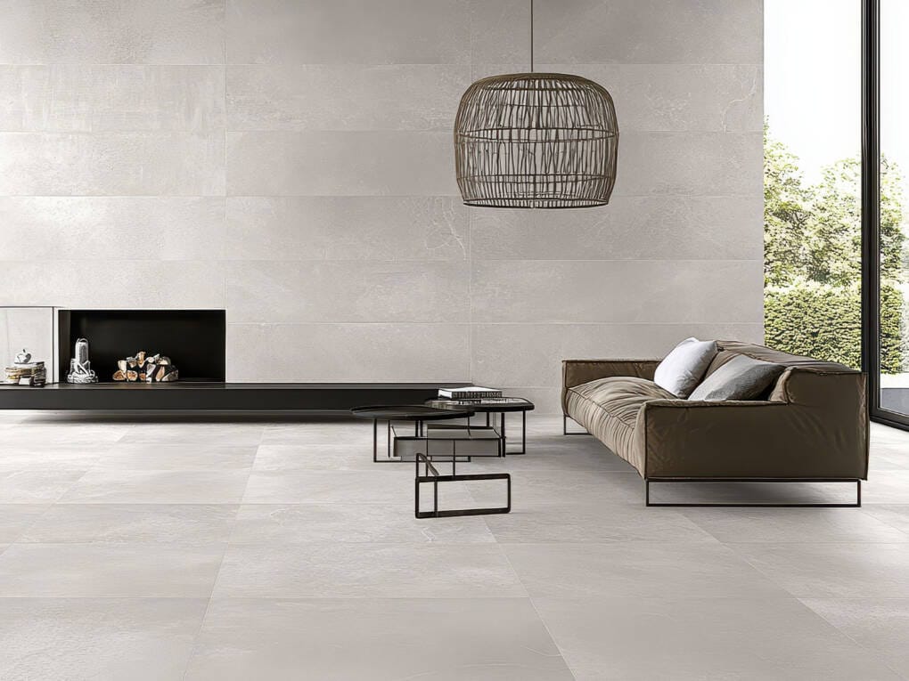 modern living room with light grey concrete look tiles and feature wall