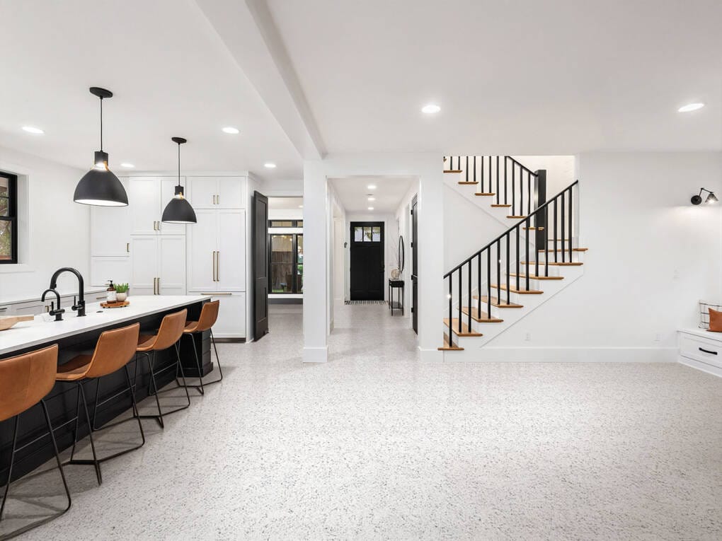 modern open plan kitchen and living room with terrazzo-look floor tiles