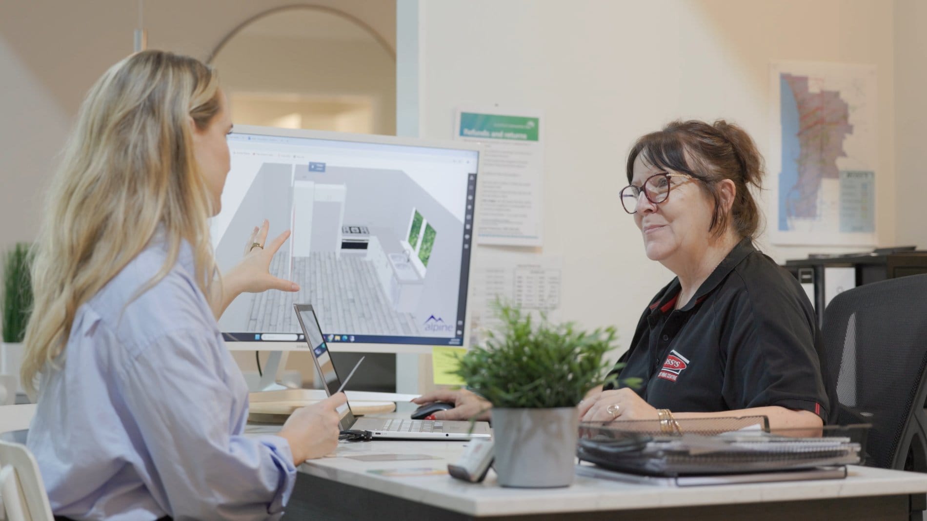 Customer receiving a free 3D kitchen design consultation at Ross’s Discount Home Centre showroom in Perth
