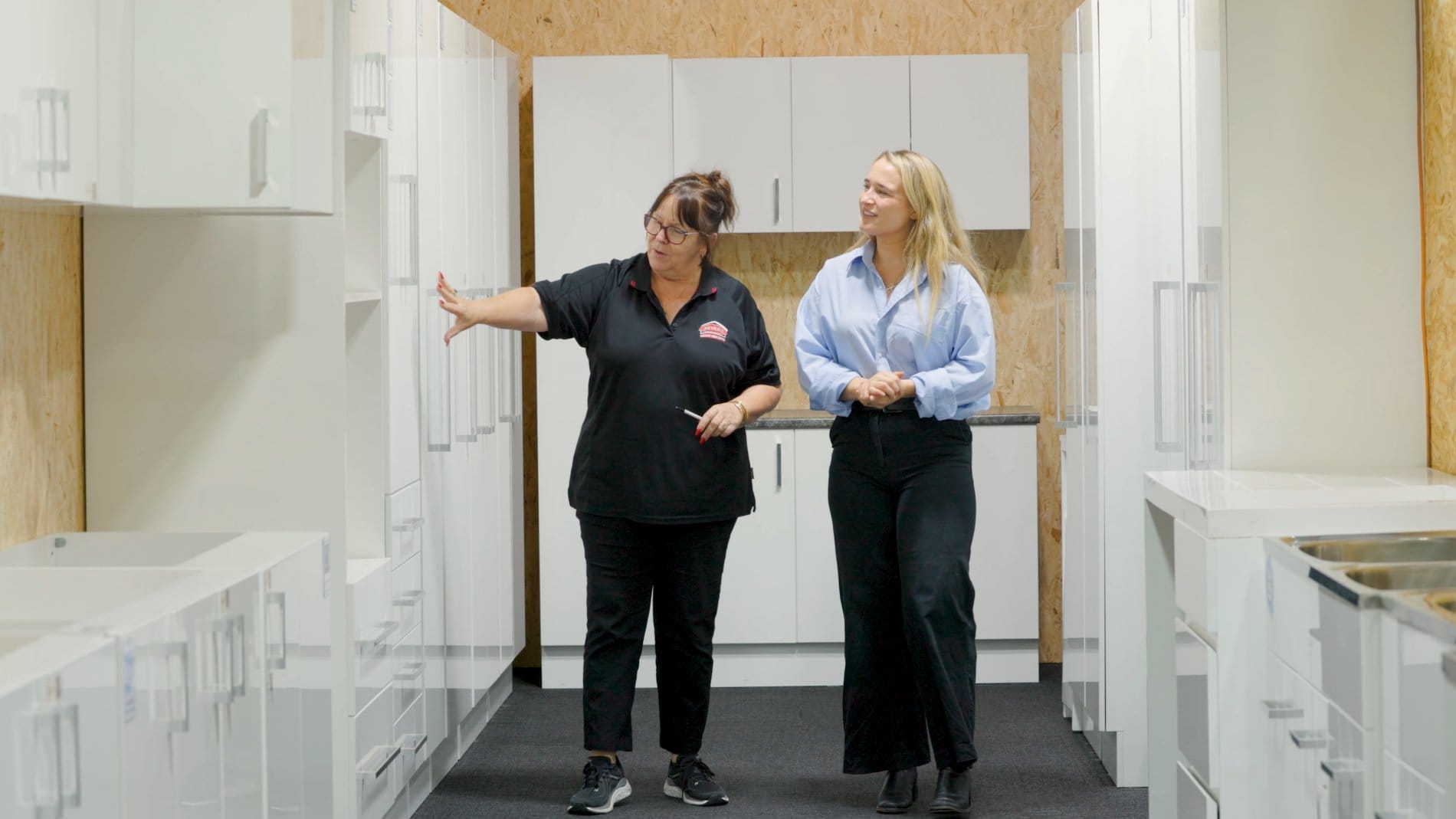 Customer consultation at Ross’s Discount Home Centre kitchen showroom in Perth, exploring cabinetry options and finishes in person
