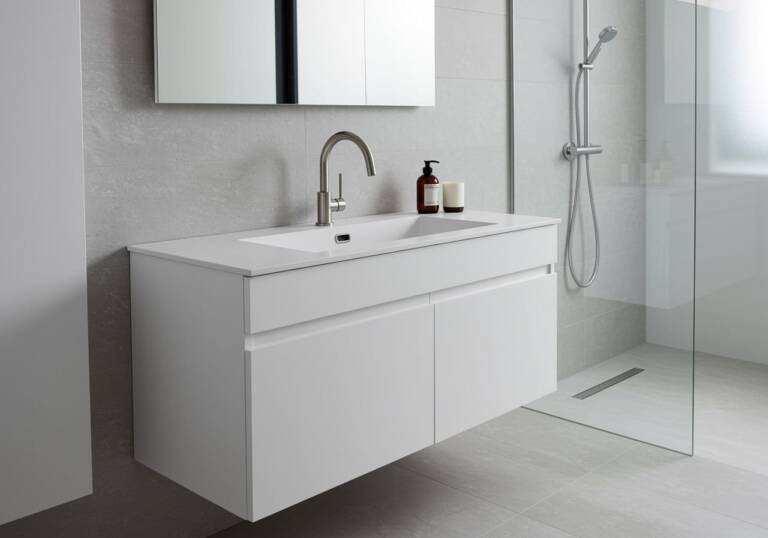 Modern bathroom with wall-hung vanity and integrated sink from Ross’s Discount Home Centre, showcasing a sleek and functional sink and cabinet combo