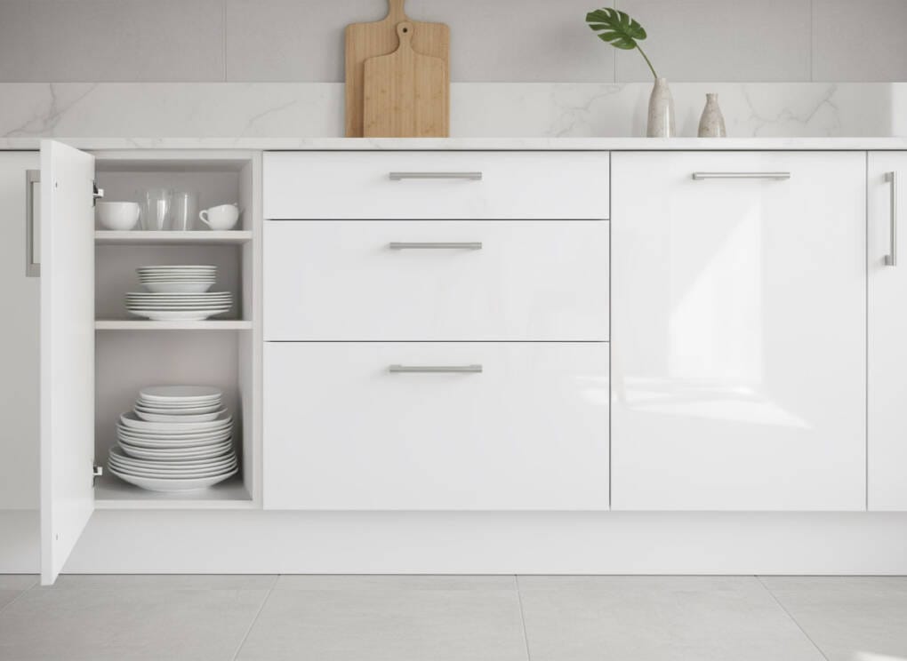 Modern white kitchen cabinets with drawers and storage shelves, showing under-bench cabinetry design in a contemporary Perth kitchen