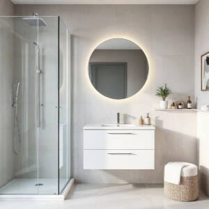 Modern small bathroom design idea with walk-in shower, floating vanity, and round LED mirror, showcasing a bright, minimalist space-saving design ideal for Perth homes