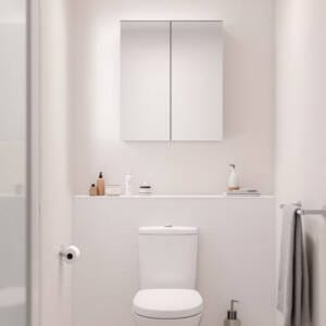 Compact toilet mirror cabinet installed above a white toilet in a minimalist powder room, showcasing modern space-saving bathroom storage ideas for Perth homes