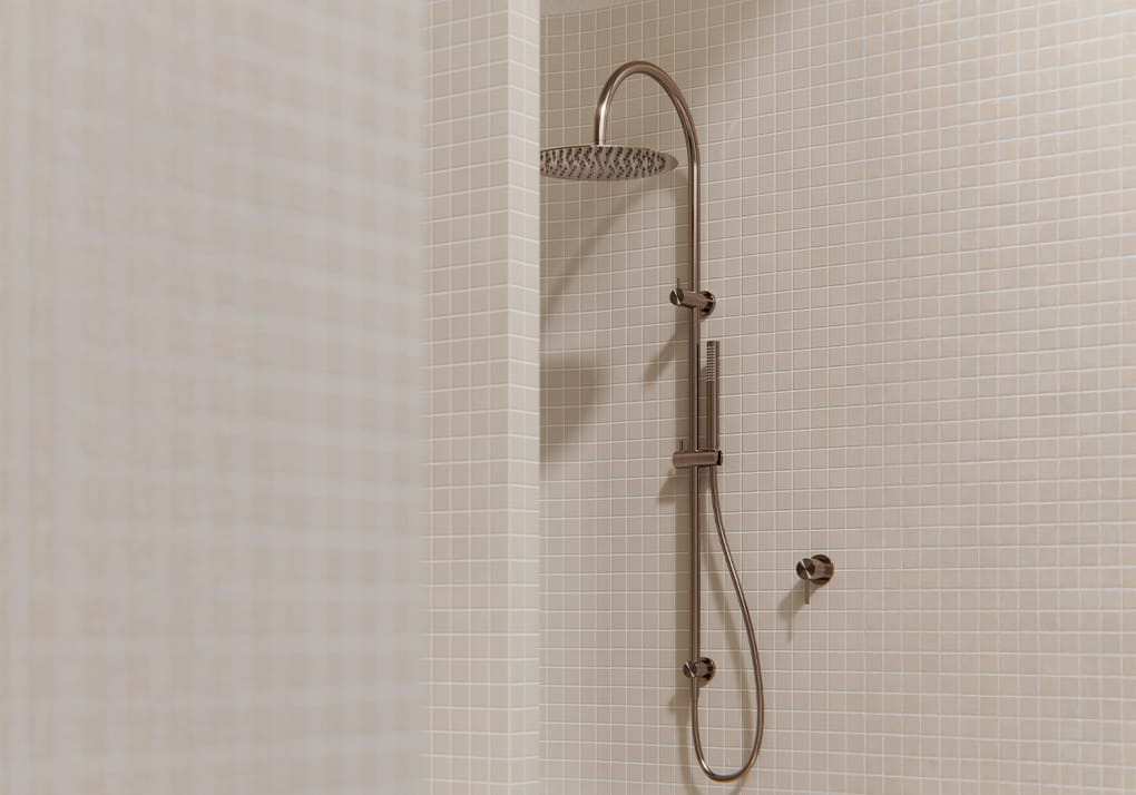 Brushed nickel dual shower head with overhead rainfall shower and integrated handheld shower on a single rail.