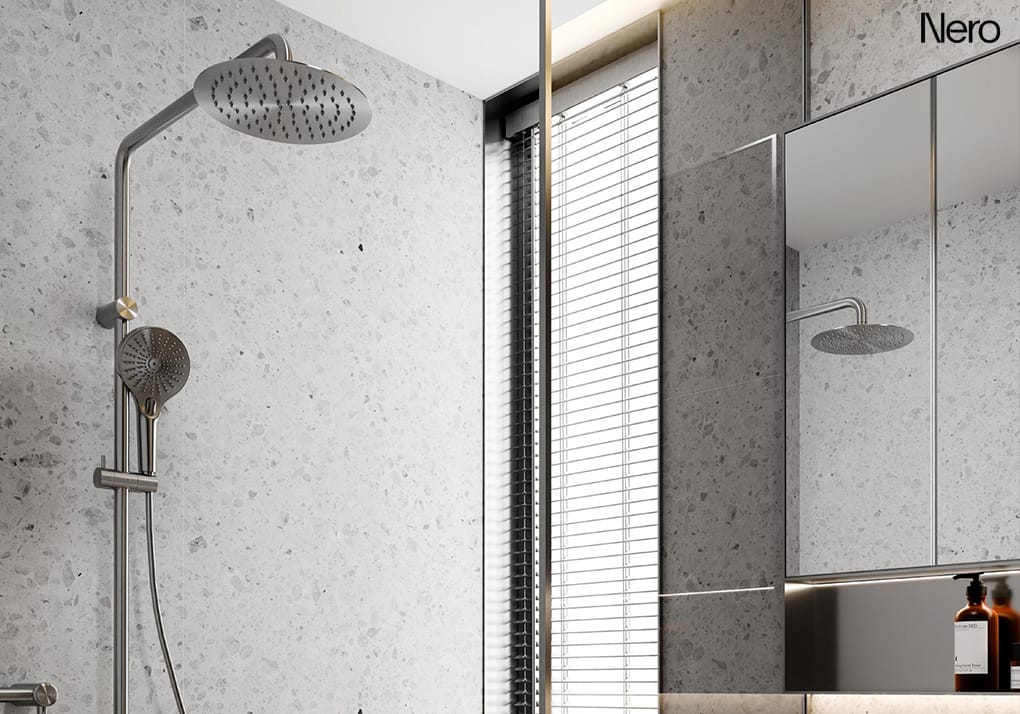 Brushed nickel dual shower head with overhead rainfall shower and integrated handheld shower on a single rail.
