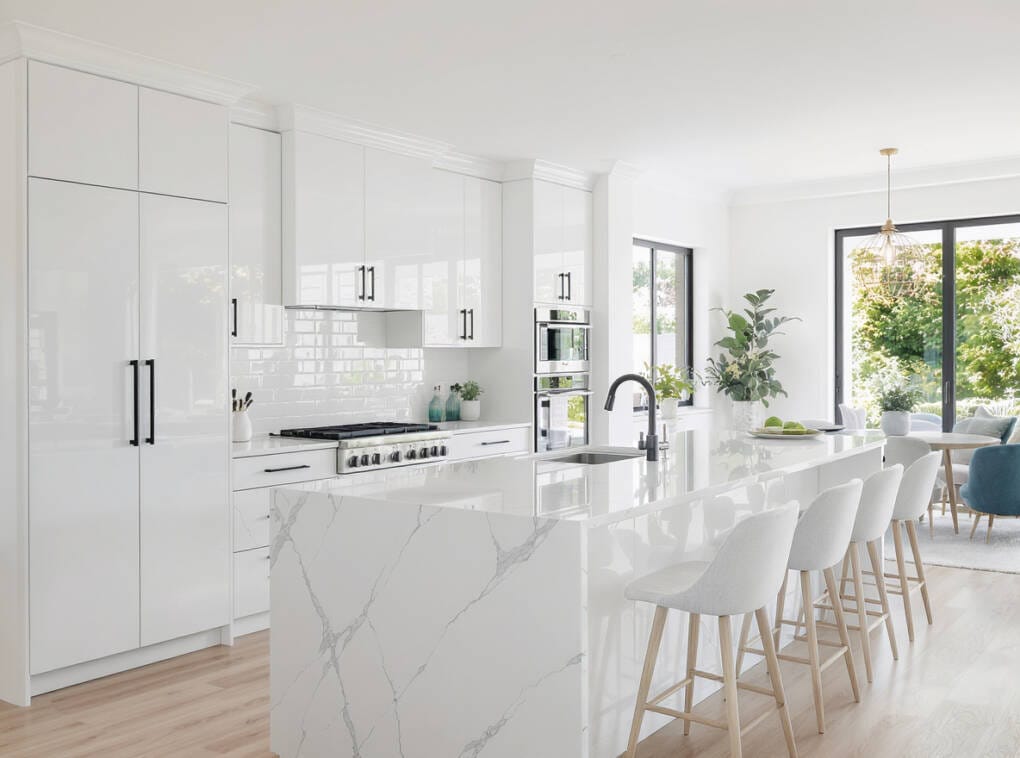 Gloss white kitchen cabinets with clean modern design and bright reflective finish