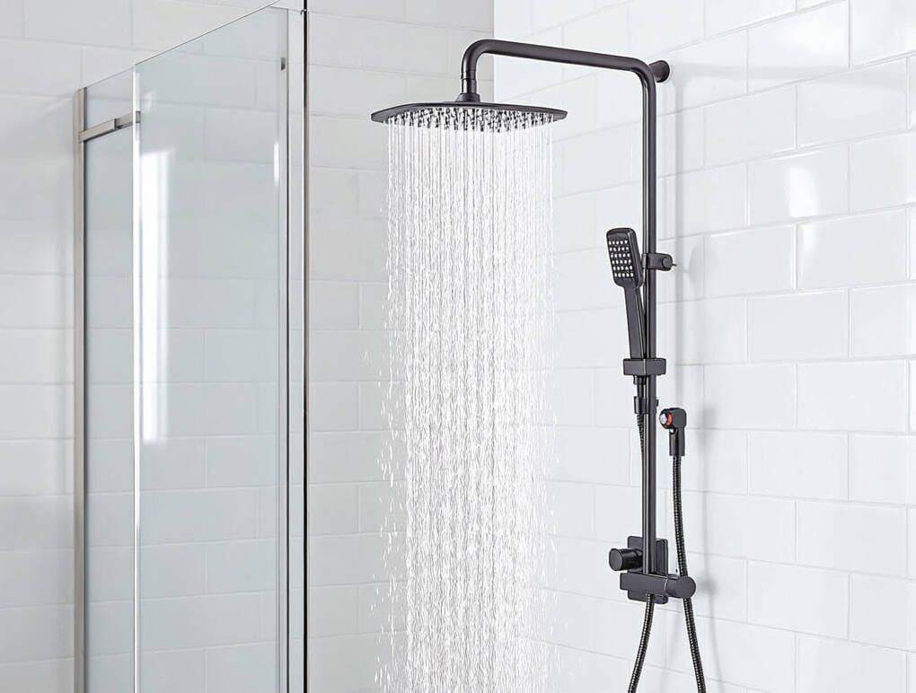 Black twin shower set with overhead rain shower and handheld shower in a modern white tiled bathroom