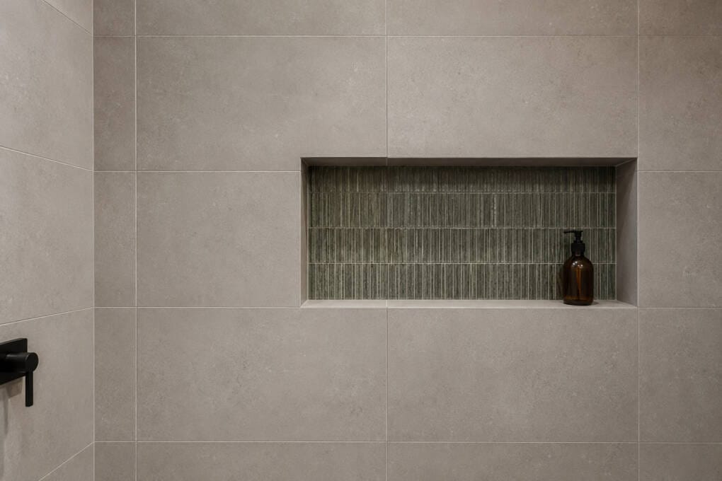 Shower niche aligned with surrounding bathroom tile grout lines