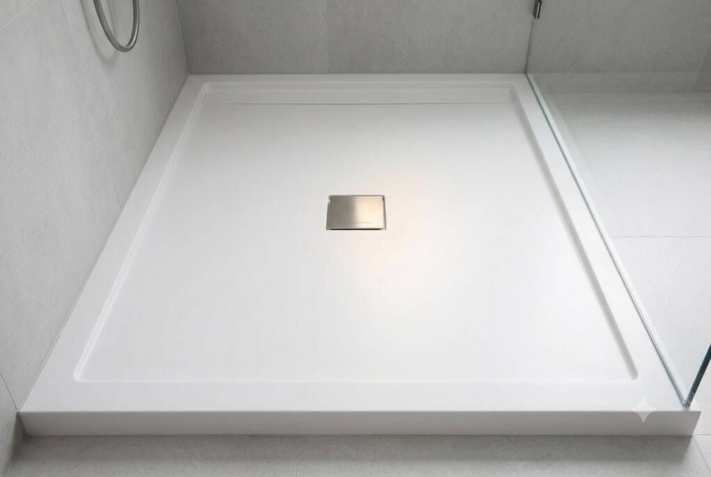 A clean, low-maintenance white shower base installed in a Perth bathroom to prevent hard water scale and mould.